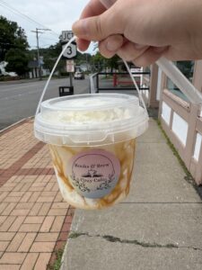 bucket of coffee with caramel Frappuccino inside